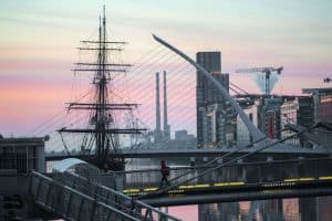 The sales of the Jeanie Johnston rise over Dublin's bridges