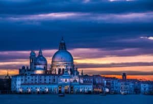 Basilica of Santa Maria della Salute in Venice lit by sunset 