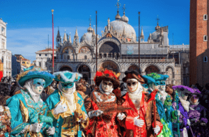 celebrators in full costumed at the Carnavale festival in Venice