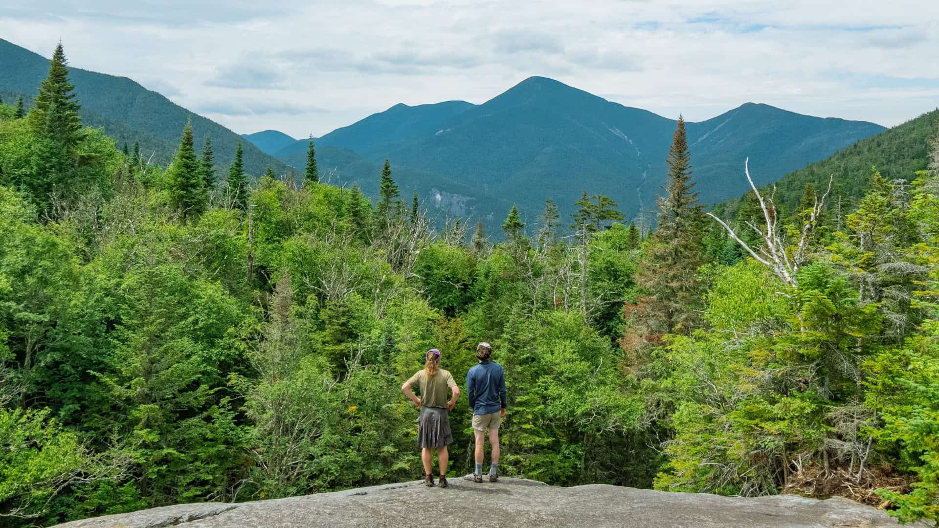 Two men enjoying the view of the Adirondack mountains on a hike