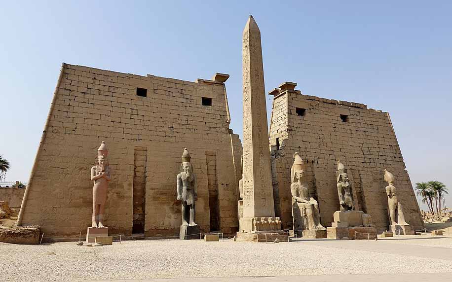 the front facade of the luxor temple, a large Ancient Egyptian temple complex located on the east bank of the Nile River