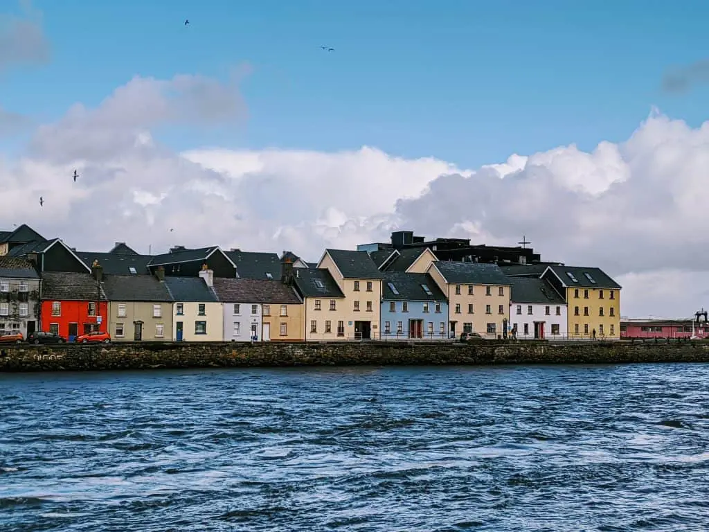 Views of the multi-colored houses along the Corrib River in Galway County