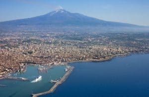 Air photo of Catania city in Sicily with the Etna Volcano in the back.