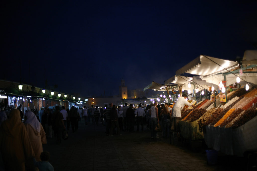 A Moroccan souq at night with all kinds of fresh food, 