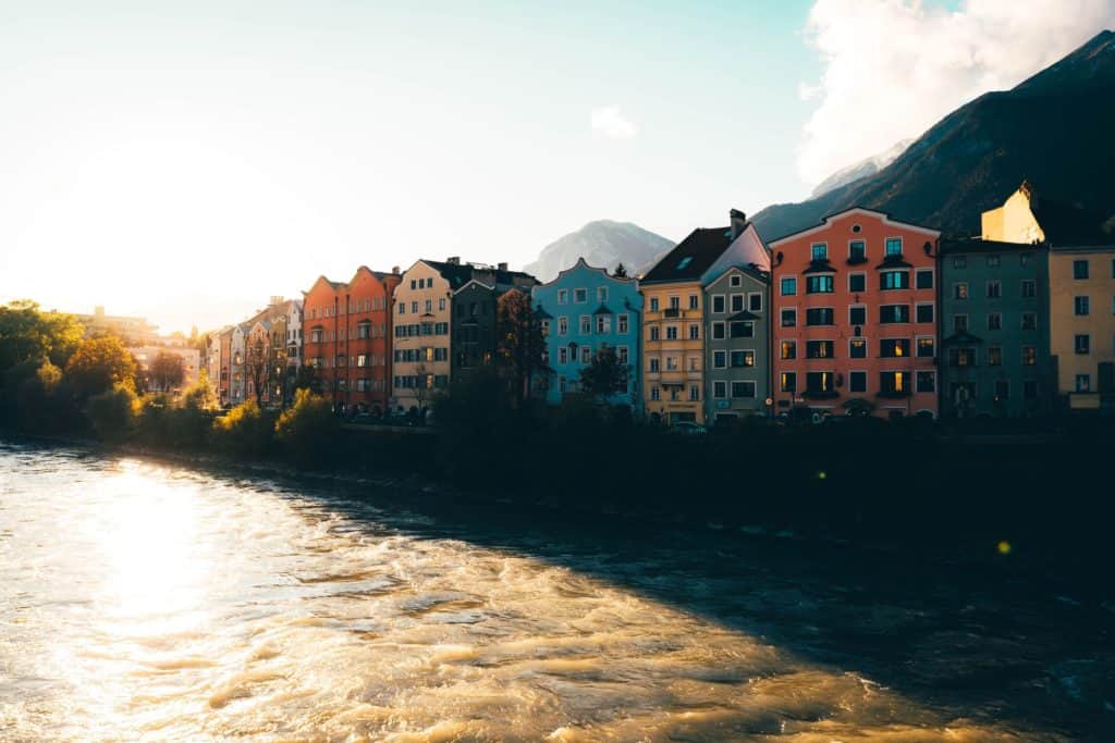 Innsbruck, Austria, colorful houses on the banks of a tranquil river