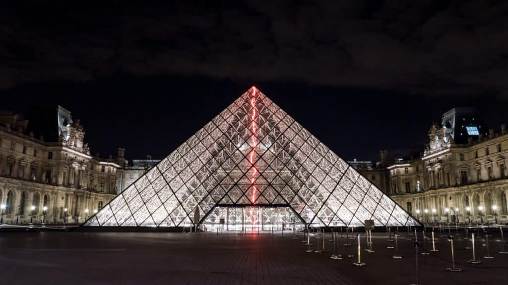 The illuminated glass pyramid at The Louvre