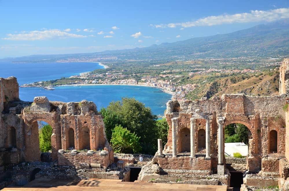 Things to do in Sicily - Ruins of the Ancient Greek Amphitheatre and the Sea in the Background