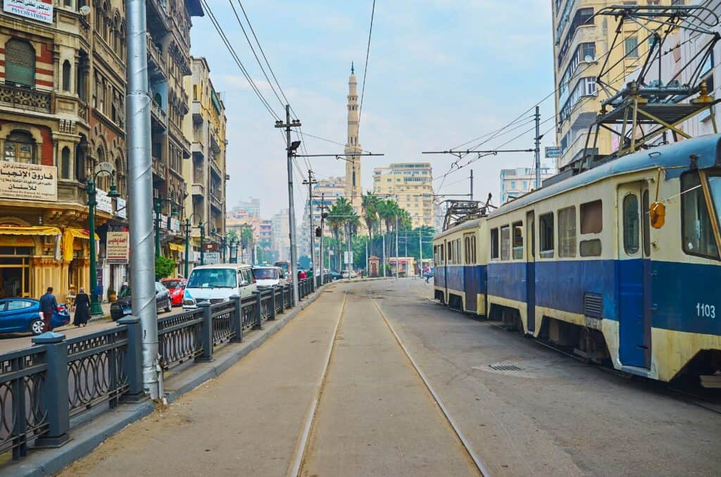 Alexandria Tram min There is no doubt that the city of Alexandria city is one of the most beautiful cities in Egypt. It is the second-largest city in the country and the largest one on the Mediterranean Sea. Alexandria is well-known by the locals as “The Pearl of the Mediterranean”. It is a famous tourist destination in the country, visited by many looking to enjoy the sea air while exploring the city’s rich history and attractions.