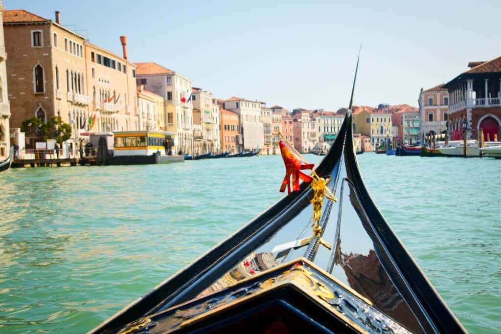 Gondola Ride min Feel like jumping right into a medieval painting? Book a flight to Venice!