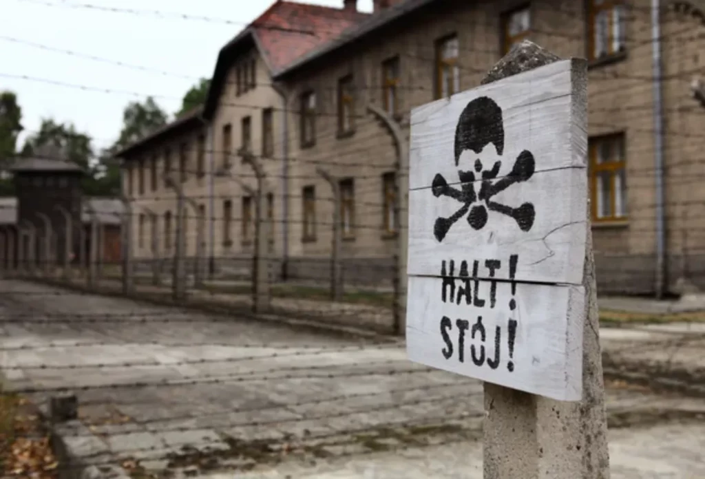 depositphotos 91803760 stock photo classic historical view of auschwitz This motto, written in German, is found on the gate to the world's most notorious site, the Auschwitz Concentration Camp in German-occupied Poland. Meaning 