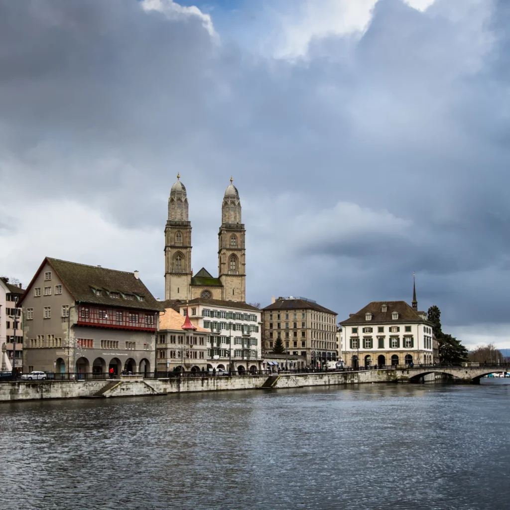 13747086 zurich cityscape It is such a challenge to pick the best city breaks in Switzerland when the entire country is a picturesque paradise. Nested in the heart of Europe, Switzerland is renowned for its unparalleled scenery, cultural diversity, mouthwatering chocolates, and cheese fondues.