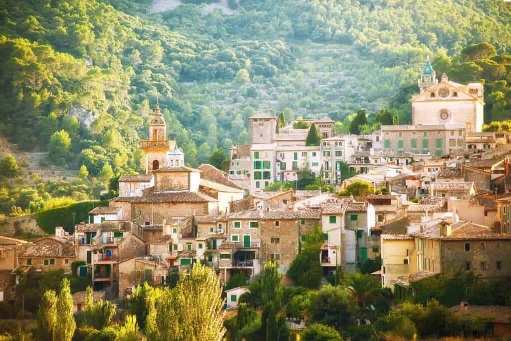 Valldemossa Village min Mallorca is an island located on the Mediterranean Sea and is considered the largest island in Spain with its capital being Palma Island. The highest peak on the island reaches 1445 meters above sea level and it also ranks second among the islands in Spain in terms of population.