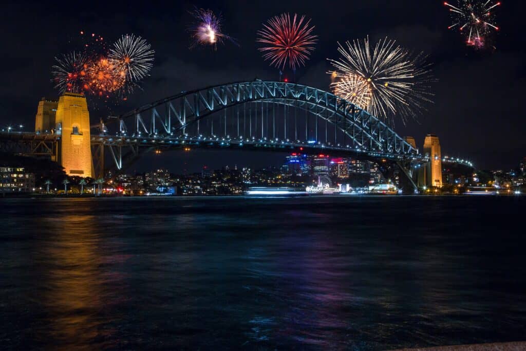 Sydney min Whether you like an elegant New Year’s dinner or an exuberant New Year’s Eve party, the fireworks remain one of the best activities to celebrate the turn of the year properly! In all cities around the globe, the new year is ushered in with lively celebrations, masked balls, and, of course, fireworks.