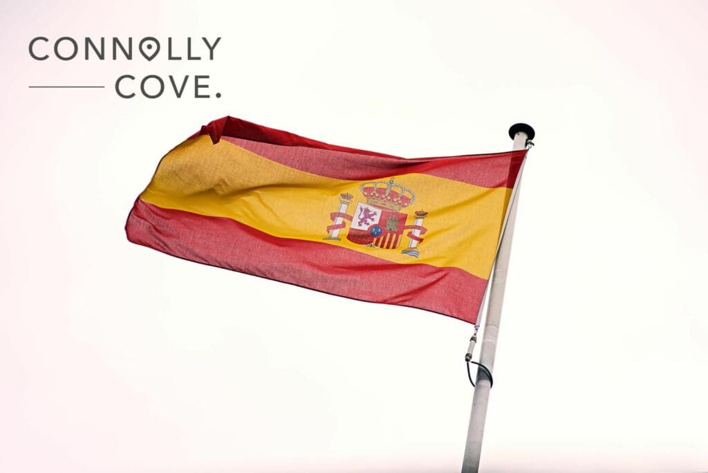 A photo of a flying Spanish flag.