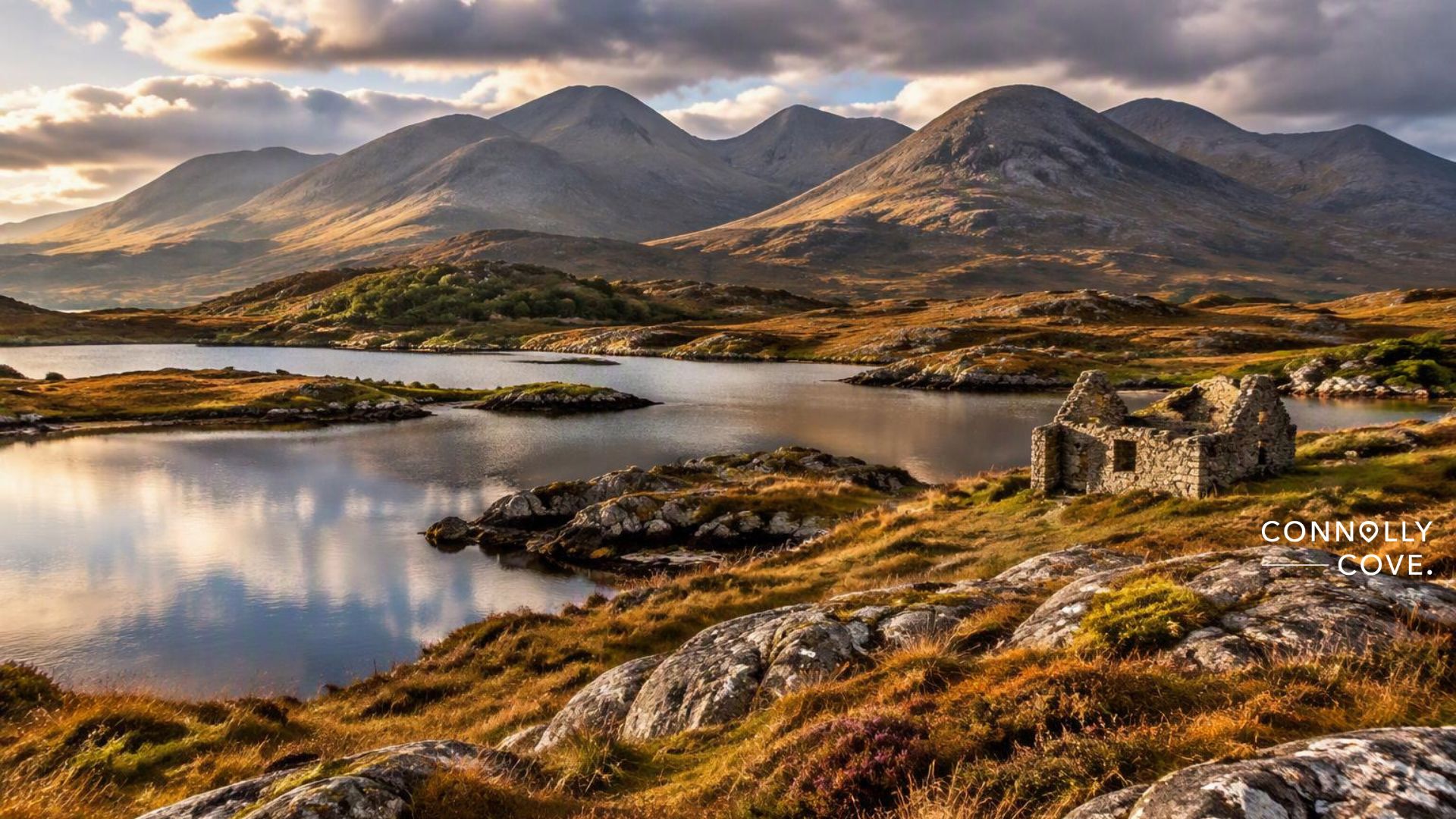 Ruins of a stone cottage in Connemara overlooking a mountain loch.