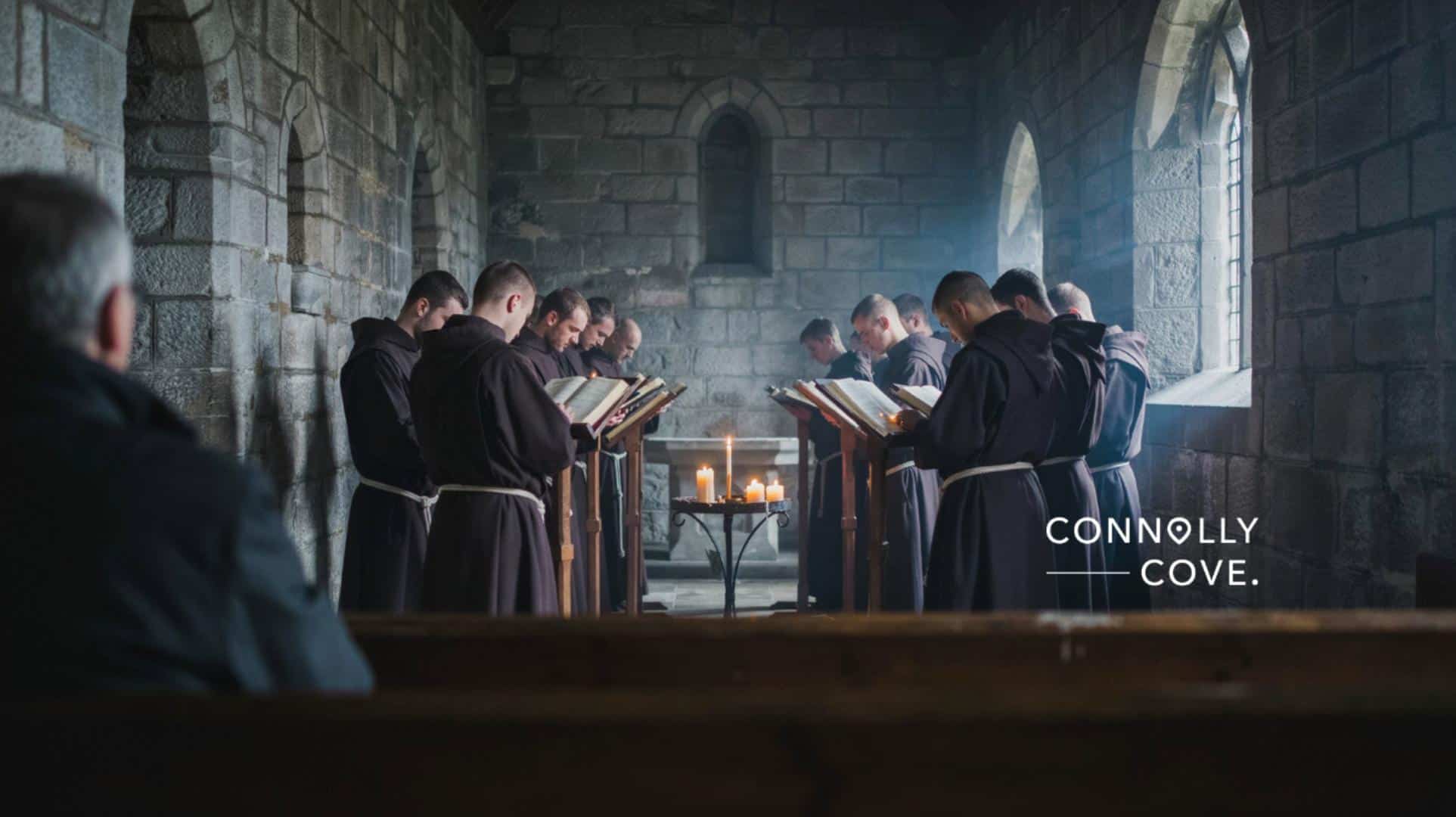 Sacred music traditions from around the globe: monks singing evening chant in a candlelit Irish stone abbey