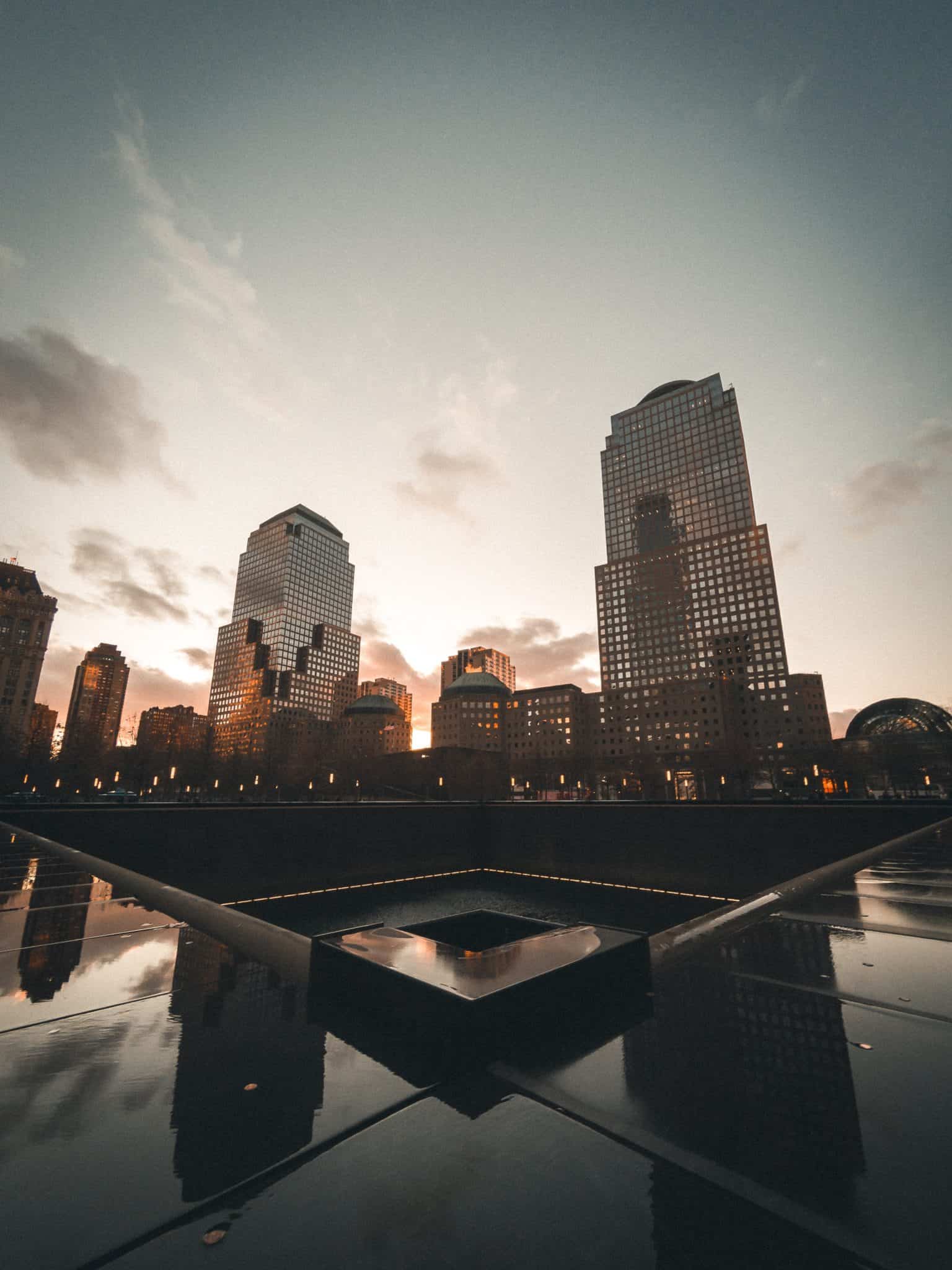 The dark granite of where a twin tower once stood in New York City