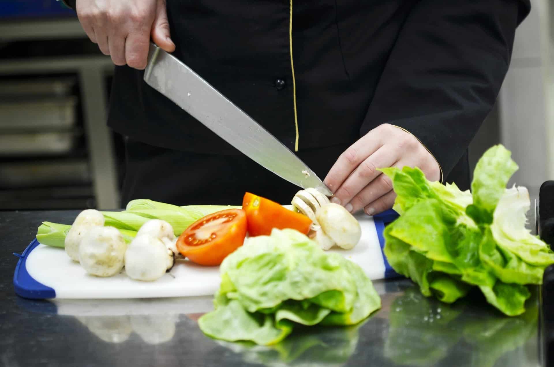 Chef preparing food as one of the hospitality jobs
