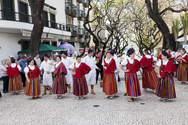 Flower festivals - performers-with-colorful-and-elaborate-costumes-taking-part-in-the-parade-of-flower-festival-on-the-madeira-island-portugal
