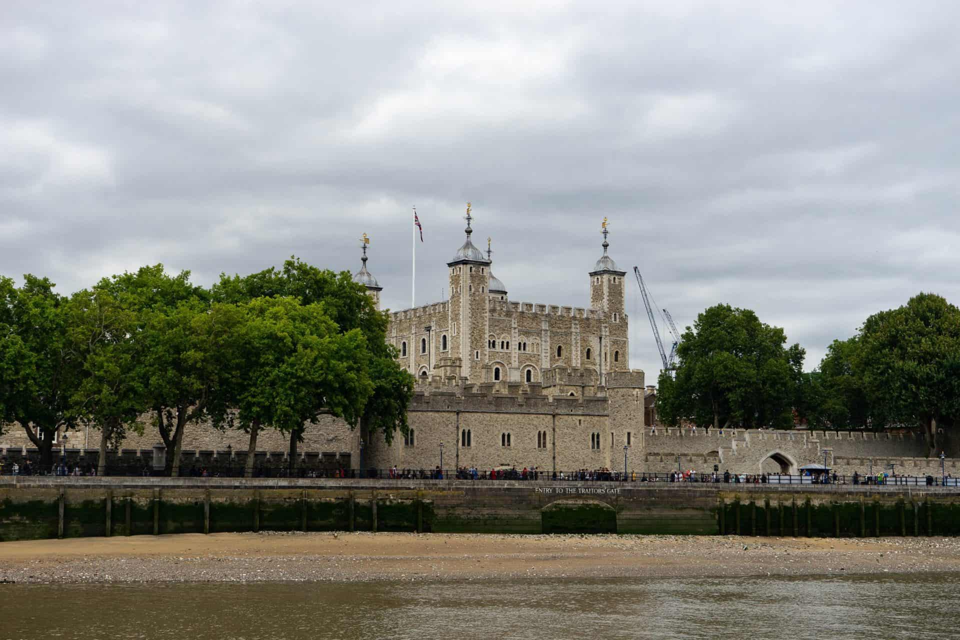 Guests pass in front of the Tower of London