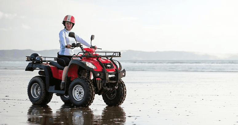 a woman sits on a quad bike in Sahl Hashish