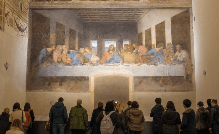 A photo of visitors admiring the mural of the Last Supper
Milan Travel Guide