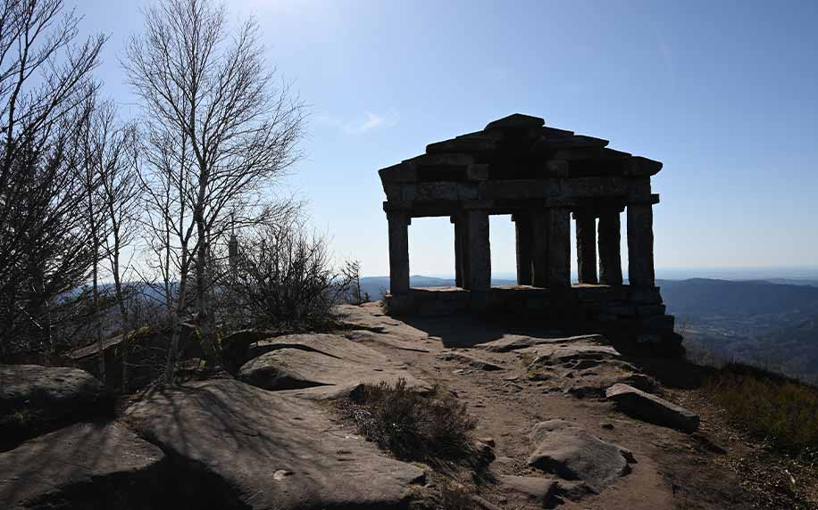a shot of the temple of mercury at the top of le donon
